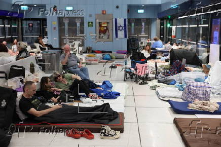 People shelter at Tel Aviv Light Rail Station amid ongoing Iranian ballistic missile threat
