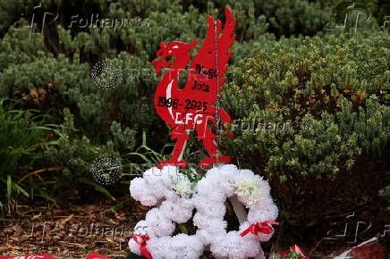 Fans pay their respects outside Anfield Stadium, on the day of the funeral of Liverpool soccer player Diogo Jota in Portugal, in Liverpool