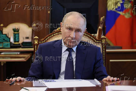 Russian President Vladimir Putin chairs a meeting on social issues, in Moscow