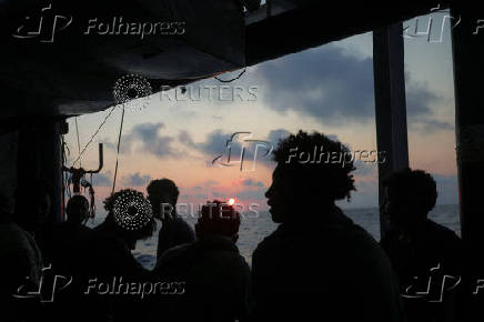 Rescued migrants aboard Sea-Watch 5 migrant search and rescue ship on their way to Italy