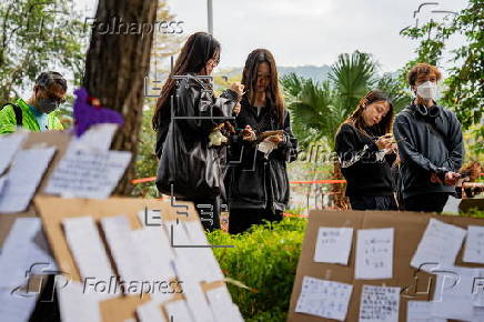 Roadside memorial for victims of the high-rise apartment fire in Hong Kong
