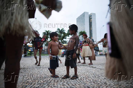 Munduruku and Guarani-Kaiowa Indigenous people participate in a protest in front of the Supreme Court