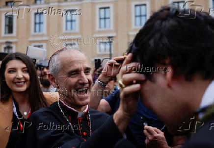 Cardinal Jean-Paul Vesco meets people ahead of the conclave to elect the next pope, as seen from Rome