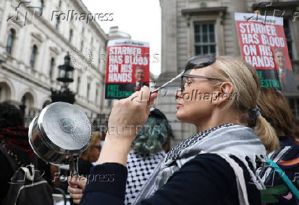 Pro-Palestine demonstrators gather outside Downing Street, in London