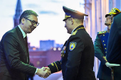 Serbian President Aleksandar Vucic shakes hands as he arrives for a meeting with Russian President Vladimir Putin at the Kremlin in Moscow