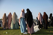 Israeli Muslims pray on the first day of the Muslim holiday of Eid al-Adha by the sea side of the Mediterranean, in Jaffa
