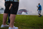 Local residents attend a burnout tire contest during 'Downtown Cruise In' car show in Union City, Indiana