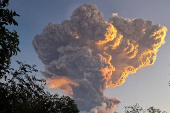 Mount Lewotobi Laki-laki spews smoke and volcanic ash as seen from Kawalelo village in East Nusa Tenggara province