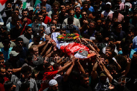Mourners take part in the funeral of of Sayfollah Kamel Musallet, killed amid the Israel-Gaza conflict, near Ramallah
