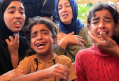 Funeral of a Palestinian killed, in what the Gaza health ministry says was Israeli fire near a distribution center in Rafah, at Nasser hospital in Khan Younis