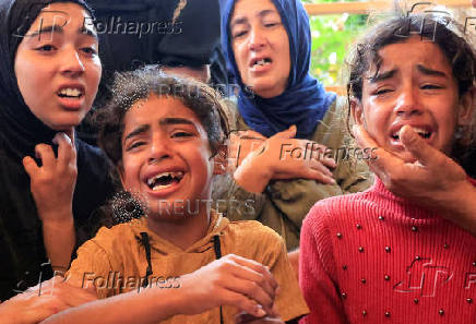Funeral of a Palestinian killed, in what the Gaza health ministry says was Israeli fire near a distribution center in Rafah, at Nasser hospital in Khan Younis