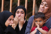 Funeral of a Palestinian killed, in what the Gaza health ministry says was Israeli fire near a distribution center in Rafah, at Nasser hospital in Khan Younis