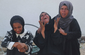 Mourners attend the funeral of Palestinians who were killed, according to medics, in Israeli fire, at Al-Shifa hospital, in Gaza City