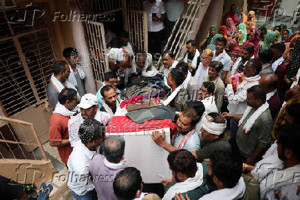 Family members carry the coffin of Ranvirsinh Chavda in Ahmedabad