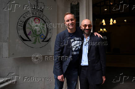 Former UBS and Citigroup trader Tom Hayes and former Barclays trader Carlo Palombo celebrate after their conviction for manipulating the LIBOR benchmark was overturned