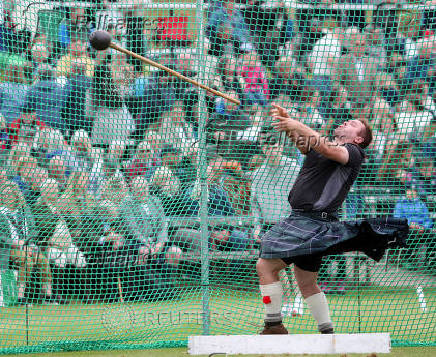 A competitor takes part in the Heavies event during the Braemar Royal Highland Gathering at the Princess Royal and Duke of Fife Memorial Park in Braemar, Scotland