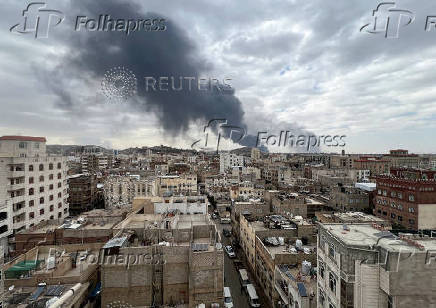 Smoke billows after an Israeli airstrike on Houthi infrastructure, in Sana'a