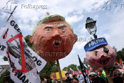 Demonstrators march against the upcoming NATO leaders' summit, at The Hague
