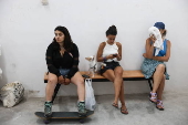 Beachgoers evacuate to shelters amid missile threat in Tel Aviv