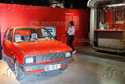 A visitor looks at Yugo car in Red History Museum in Dubrovnik
