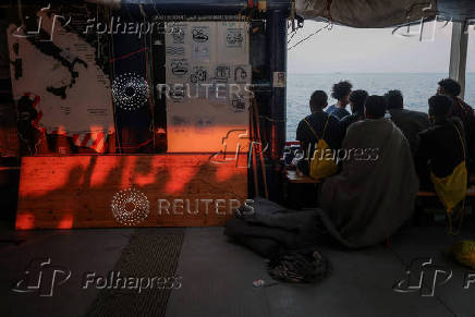 Rescued migrants arrive aboard Sea-Watch 5 ship in Salerno