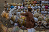 Men arrange cane stools for sale in Rawalpindi, Pakistan