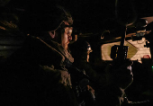 Servicemen of the Ukrainian Armed Forces ride a military vehicle at a front line in Donetsk region