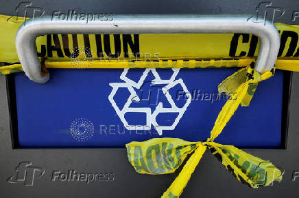 Caution tape seals off public trash bins in Waltham