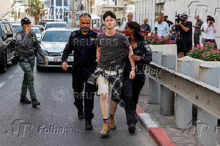 People take part in a protest against what organizers call 