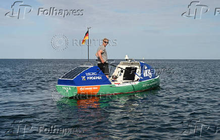 German stand-up paddler Michael Walther takes to the Baltic Sea for a test run in Kiel