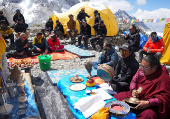 A Buddhist monk participates in the pooja before the expedition at Everest base camp