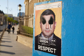 A vandalised electoral poster of George Simion is seen in Bucharest