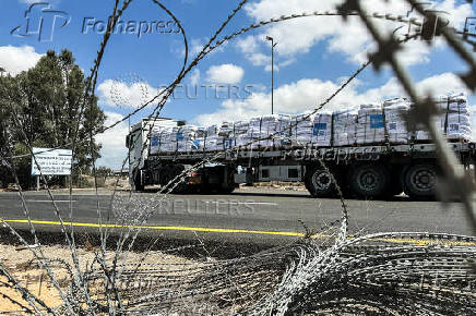 A truck carrying aid arrives at the Kerem Shalom crossing between Israel and Gaza, on its Israeli side