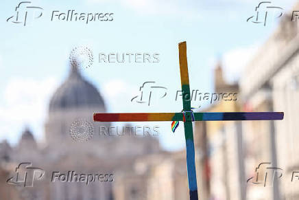 LGBTQ pilgrims walk toward St. Peter's Basilica