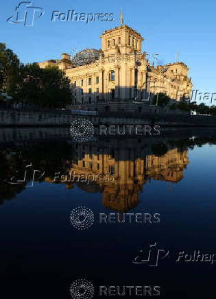 Sunlight illuminates the Reichstag building, the seat of the German parliament, in Berlin