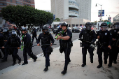 Protesters gather around the Los Angeles Federal Building after multiple detentions by ICE, in Los Angeles