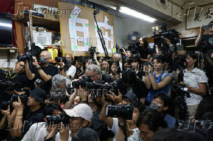Reporters photograph the press conference where Chan Po-ying, chair of Hong Kong?s League of Social Democrats, along with party members announces the party?s dissolution amid China?s national security law, in Hong Kong