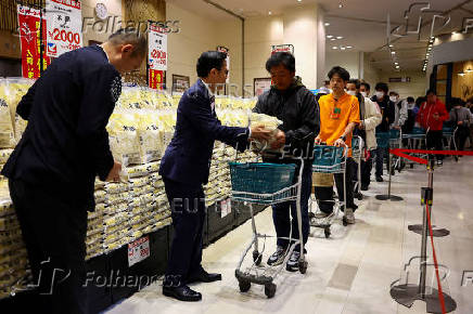 FILE PHOTO: FILE PHOTO: Government-stockpiled rice aimed at resolving persistent price rises sold in Tokyo
