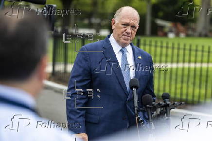 White House border czar Tom Homan talks with news media outside the White House