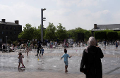 People enjoy the weather in London