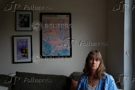 Jenna Norton, an employee at the National Institute of Diabetes and Digestive and Kidney Diseases, sits for a portrait in Bethesda, Maryland