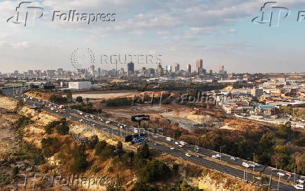 A drone view shows cars driving on a motorway
