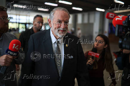U.S. Ambassador to Israel Mike Huckabee enters the district court during Israeli Prime Minister Benjamin Netanyahu's trial on corruption charges, in Tel Aviv