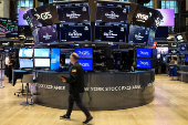 Traders work on the floor of the NYSE in New York