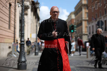 Cardinals walks ahead of the conclave to elect the next pope