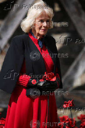 Britain's Queen Camilla views an installation of 30,000 ceramic poppies commemorating the 80th anniversary of Victory in Europe (VE) Day in London