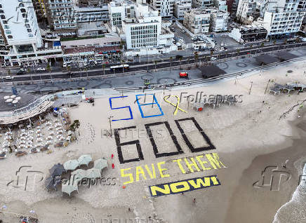 A drone view shows Israeli protesters display the words 