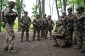 Foreign volunteers of the Ukrainian National Guard brigade attend military exercises at a training ground near a front line in Kharkiv region
