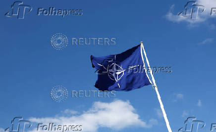 A NATO flag flutters at NATO headquarters in Brussels