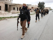 Soldiers from the Public Security walk in Aleppo